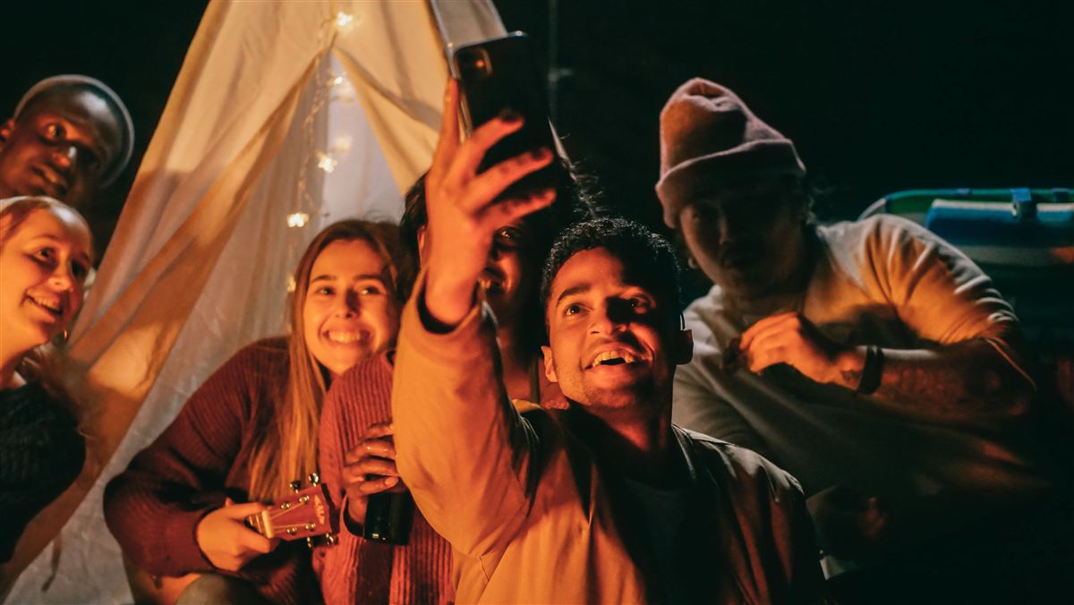 Friends on a camping trip at night
